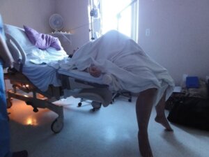 Spinning Babies If the difficulty comes from the curvature of the lumbar region ... put the parturient in a position with her knees flexed so that, with the vulva situated at the top, the pathways are easier.