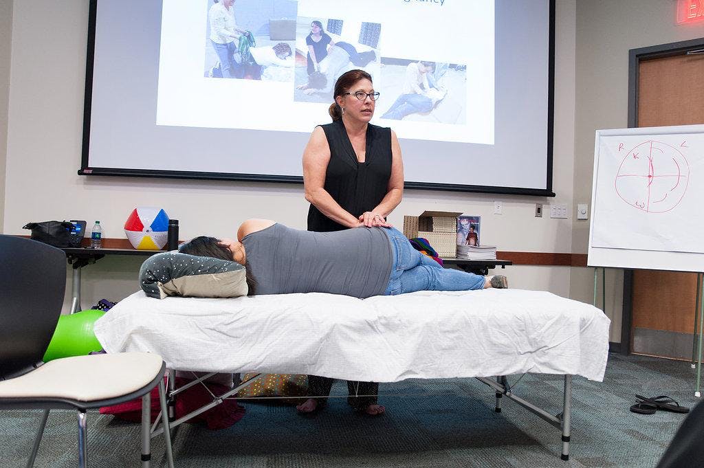 Spinning Babies DESCRIPTION
Join International birth worker, Speaker & Spinning Babies® Approved Trainer Tammy Ryan for a Spinning Babies® Workshop!
Understand the role of muscles and ligaments in preparation and progress in childbirth. Effects of posterior, solutions for transverse lie, and labor patterns when baby needs to rotate in the pelvis. Reduce unnecessary cesareans due to lack of progress in labor.
Charge your practice with the new paradigm in childbirth by identifying where the baby is so you can: Align the uterus so baby can curl and enter the pelvis as a small, compact – and more active participant. Release tight ligaments or muscles which may pull or twist may relieve pelvic pain now or discomfort during birth. Open the pelvis to let baby move down during the birth process Catered snacks and lunch from a local woman-owned business included in the workshop fee!
Workshop is open to: Childbirth Educators, Doulas, Midwives, Labor & Delivery Nurses, Physicians, Any practitioner working with pregnant/laboring people (Body Workers)
CEU’s: American College of Nurse Midwifery has awarded this course with 0.7 CEUs. This workshop has been approved for 7 advanced Doula Training contact hours, 7 contact hours.
Cost: $175 USD Early Bird pricing through September 6, $200 USD Regular price beginning September 7.
Up to 10 spots have been reserved for Birth Workers of Color, eligible for a sliding scale price of $30.
Details: Please bring a pillow. If you have a yoga mat and/or a rebozo please bring those also. We will work in pairs so if you don’t have the above we will put you with someone who does. Babies in arms welcome.
Cancellation Policy: 100% if you miss for a birth, if I am contacted by 7am the day of the workshop Email Approved Trainer Tammy Ryan at ServantHands123@aol.com