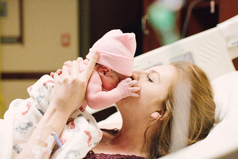 Dancee with newborn baby girl