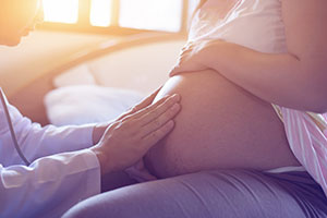 care provider with pregnant person