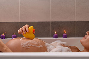 pregnant woman taking a bath